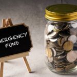 All images in the blog post would have descriptive alt text, such as "A piggy bank labeled 'Emergency Fund' being filled with coins" or "A diagram showing the difference between a checking account and a high-yield savings account for an emergency fund.