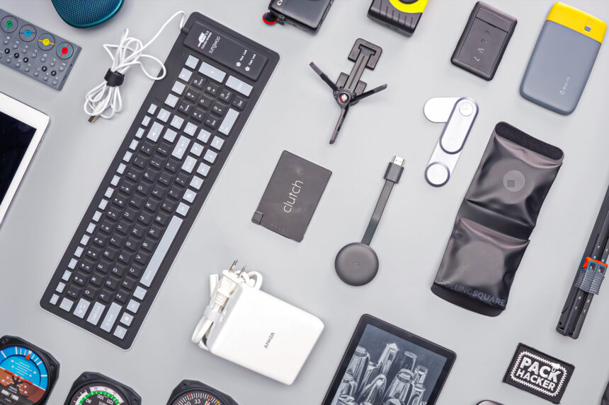 Stylized collage of the top 5 must-have tech gadgets for 2025, featuring a smart ring and AI glasses