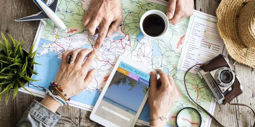A diverse collage of travel destinations - a beach, a mountain, and a city - with the text "The Ultimate Beginner's Guide to Planning a Vacation" overlaid.
