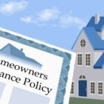 A homeowner looking at their house, wondering about the gaps in their home insurance policy