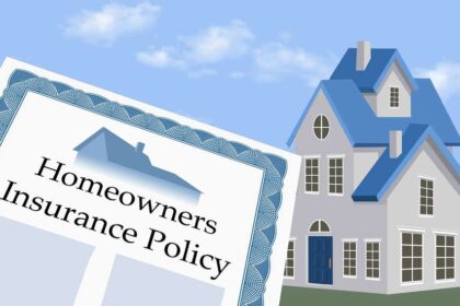 A homeowner looking at their house, wondering about the gaps in their home insurance policy